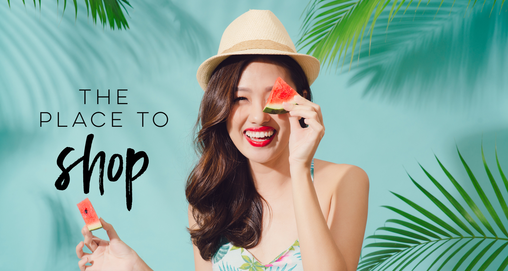 The Place to Shop woman wearing hat smiling and holding slices of watermelon